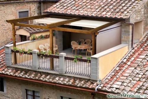 Крепление козырька к кирпичной стене. Крепление навеса к кирпичной стене