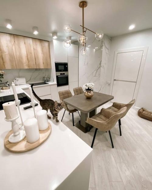 Прекрасный интерьер кухни - гостиной в светлой цветовой гамме. 02