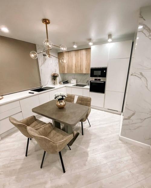 Прекрасный интерьер кухни - гостиной в светлой цветовой гамме.