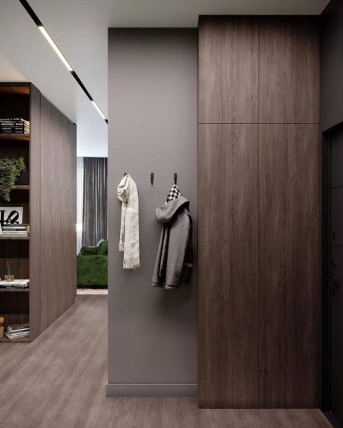 Стильный вариант обустройства прихожей в темной цветовой гамме. 02