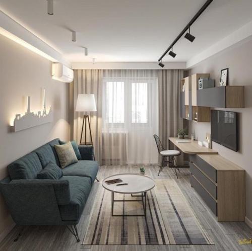 Обустройство гостиной может быть разным.