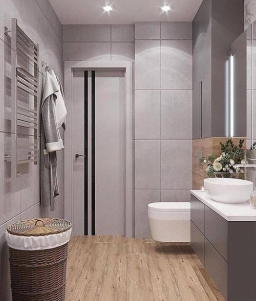 Совмещенный санузел в сером цвете.