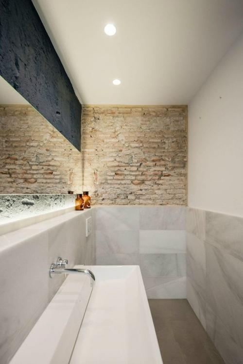 Квартира в Валенсии сохранила следы своей истории, став современным и атмосферным пространством. 06