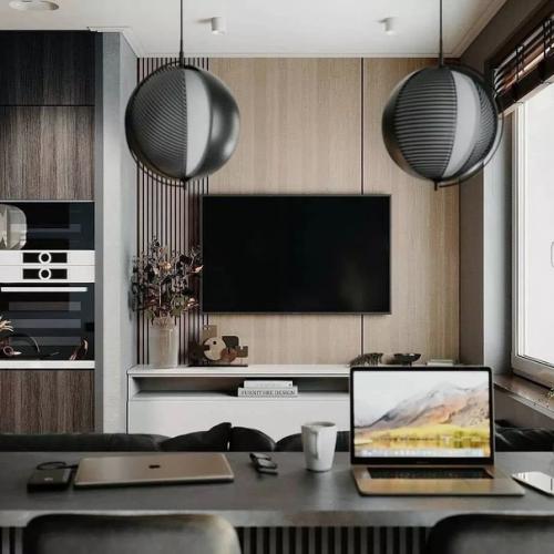 Кухня - гостиная в достаточно таки темной цветовой гамме.