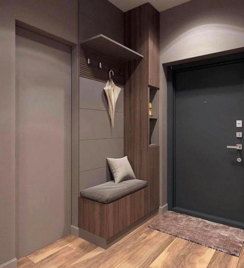Стильный интерьер прихожей в темном сером цвете.