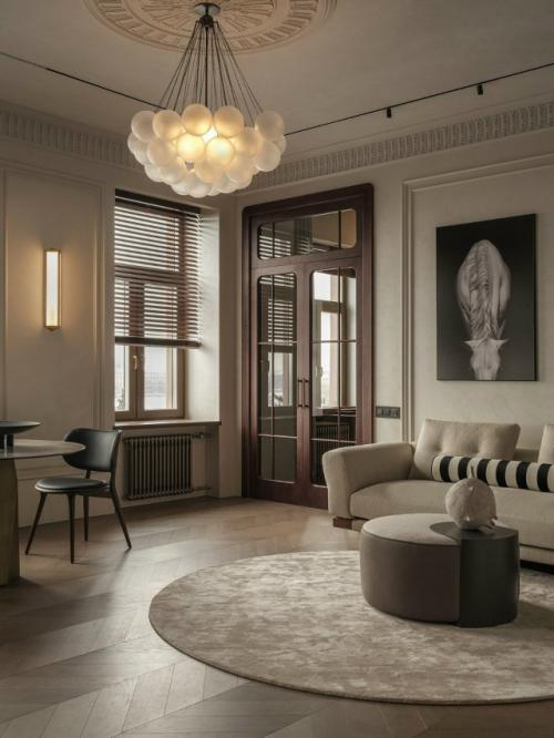 Интерьер оформлен в духе современной классики с уважением к истории здания эпохи ар - нуво.  